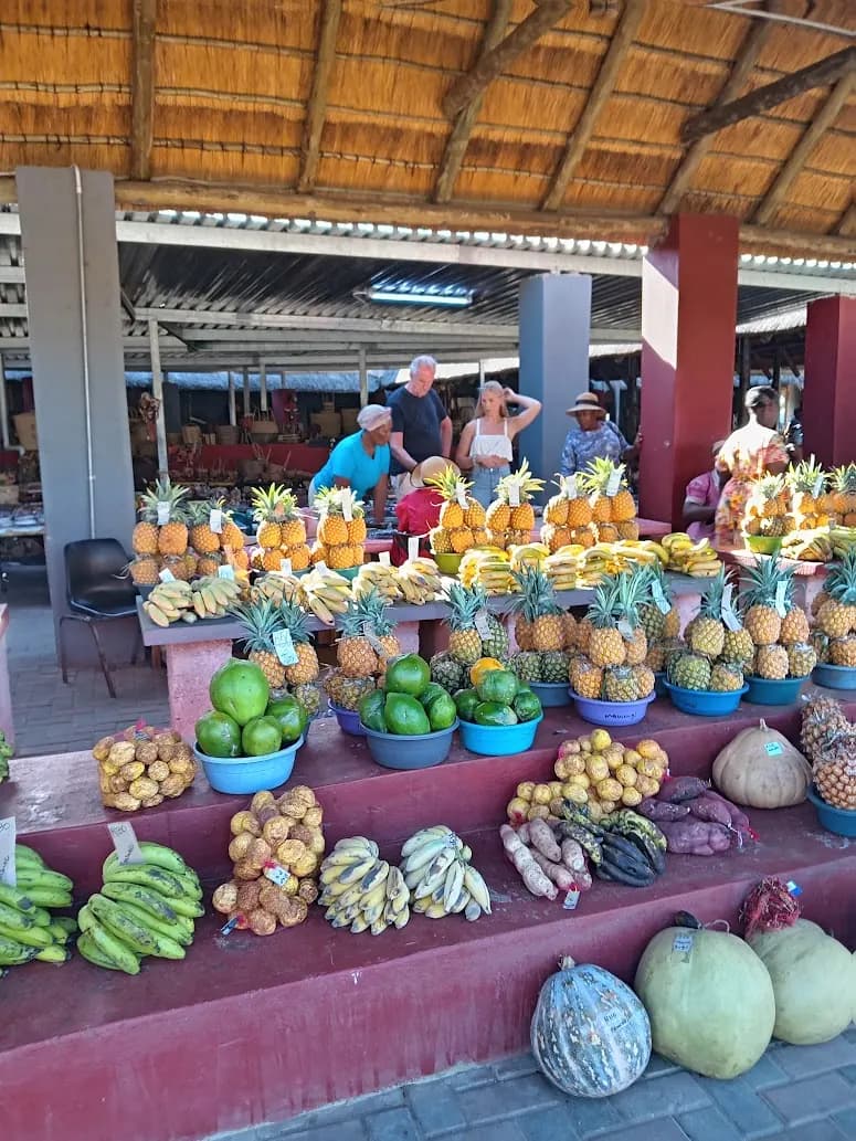 Roadside fruit stall with pineapples and bananas